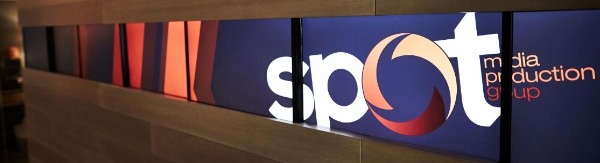 Spot Media Production Group Logo on TV Wall