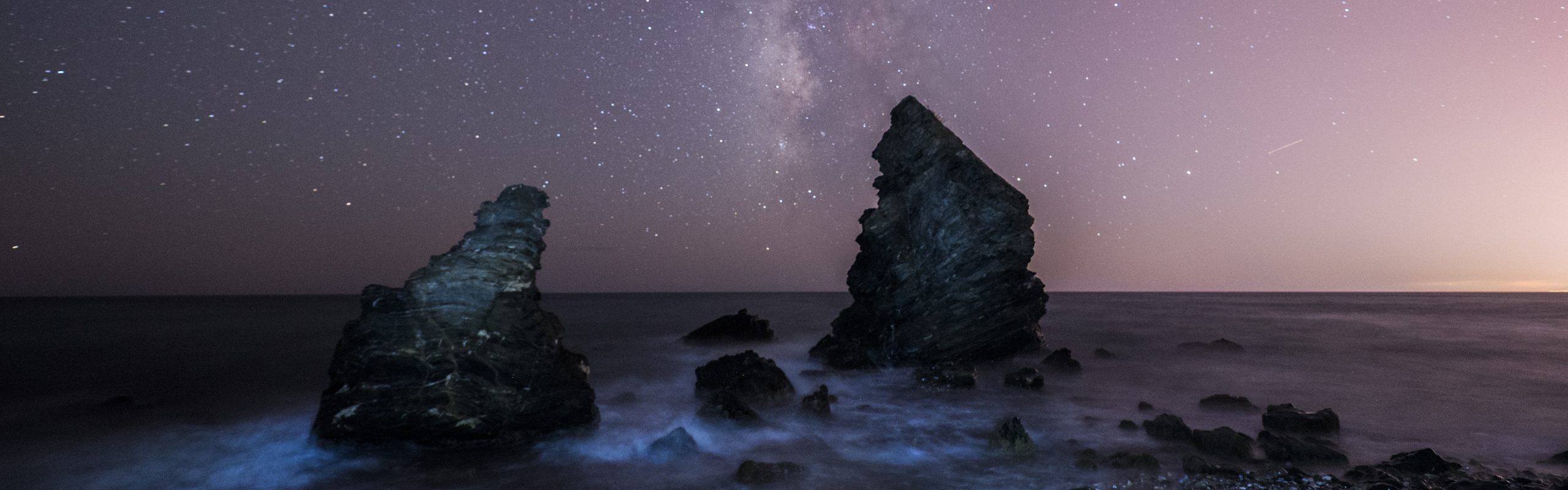 The Night Sky and Milky Way Over the Coast Cropped From an Image by Manolo Franco Hosted on Pixabay